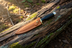 Knife with a brown leather sheath.